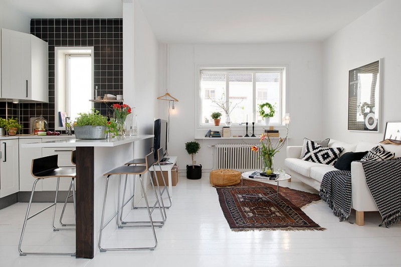 czarno-białe meszkanie,nowoczesny salon z kuchnią, otwarta zabudowa mieszkania,skandynawskie meszkanie,skandynawski styl