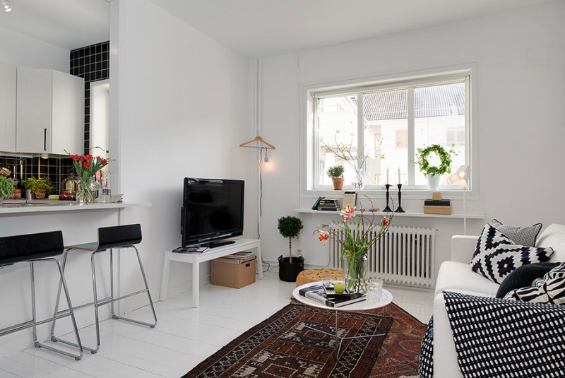 czarno-białe meszkanie,nowoczesny salon z kuchnią, otwarta zabudowa mieszkania,skandynawskie meszkanie,skandynawski styl