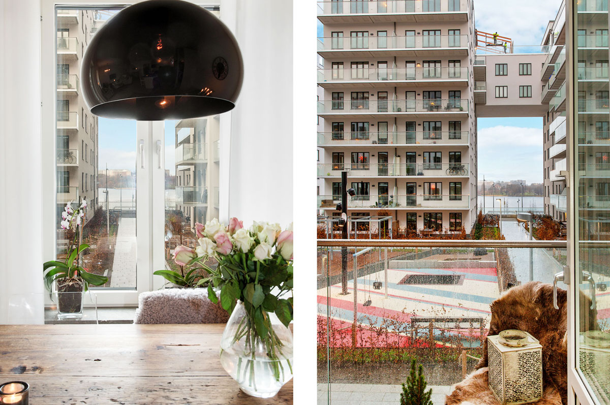 stół vintage,czarna lampa,transparentny czarny abażur,widok z balkonu,nowoczesne osiedle,skandynawskie mieszkanie